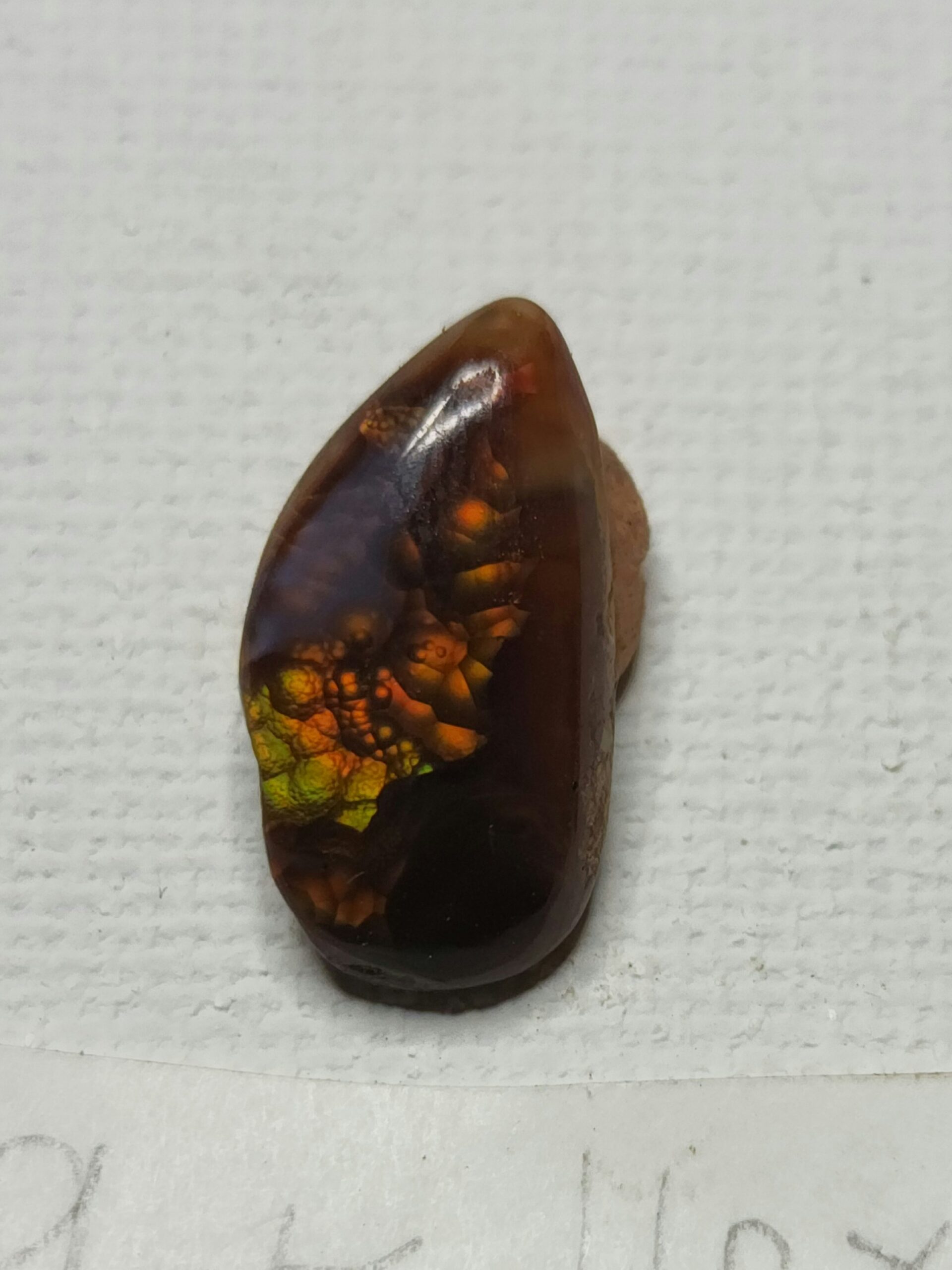 3.49ct 16x9mm Tear Drop Cabochon with Vibrant Yellow, Orange, and Red Flash