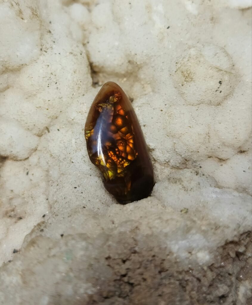 3.49ct 16x9mm Tear Drop Cabochon with Vibrant Yellow, Orange, and Red Flash